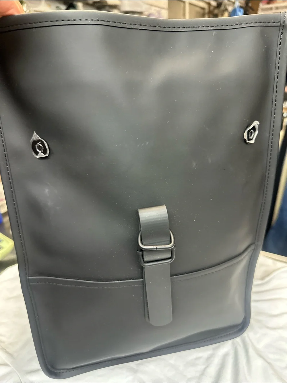 Rains  Backpack is clean and ever-contemporary. Like new no tag